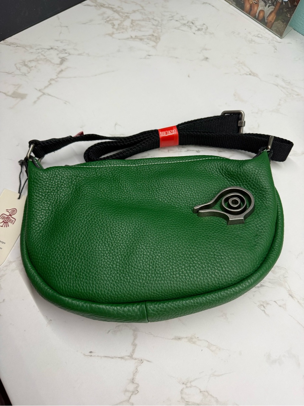 Green Leather Crossbody with Modern Sculptural Accent